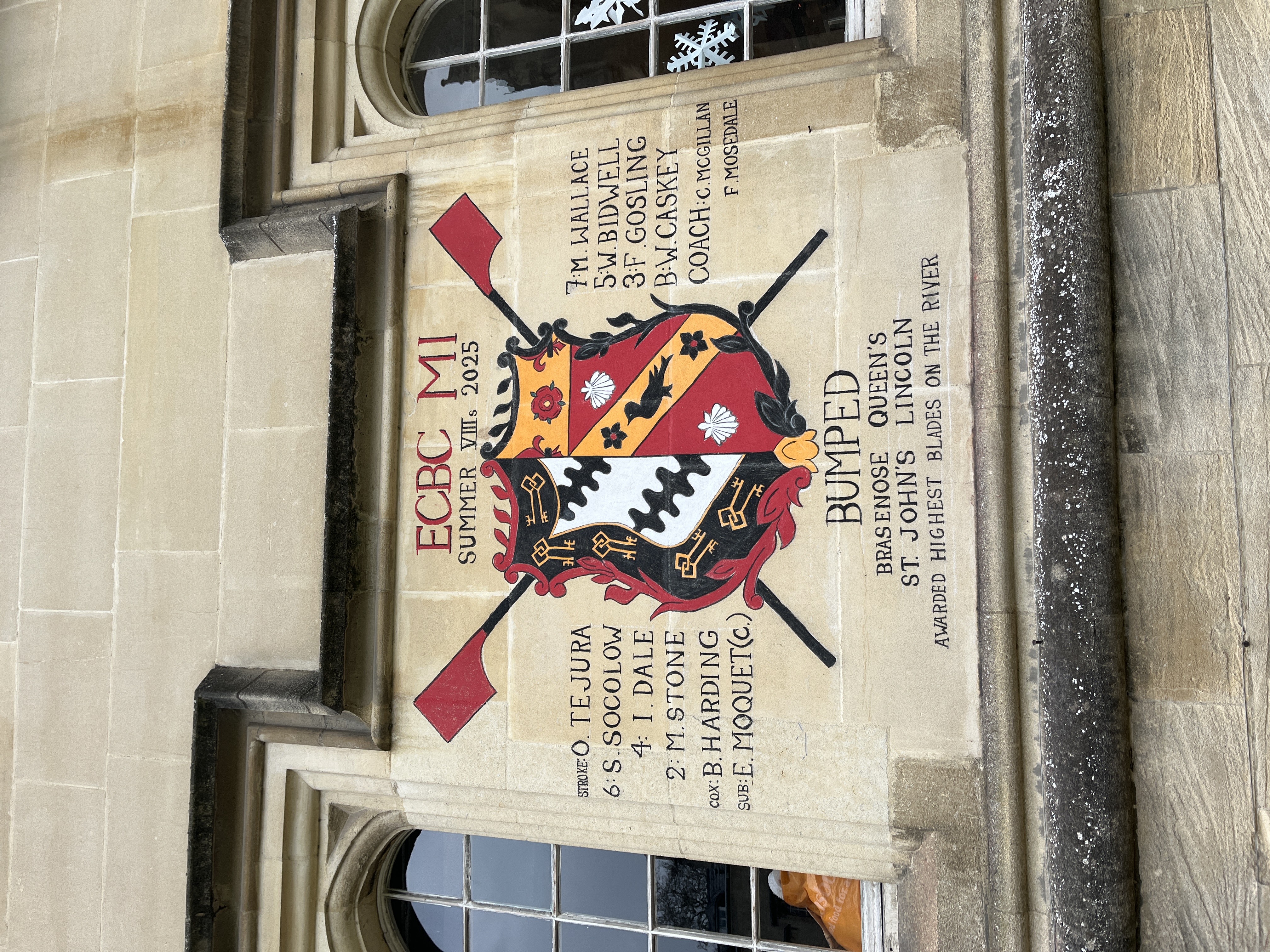 Blades chalked in front quad showing names and the ECBC crest
